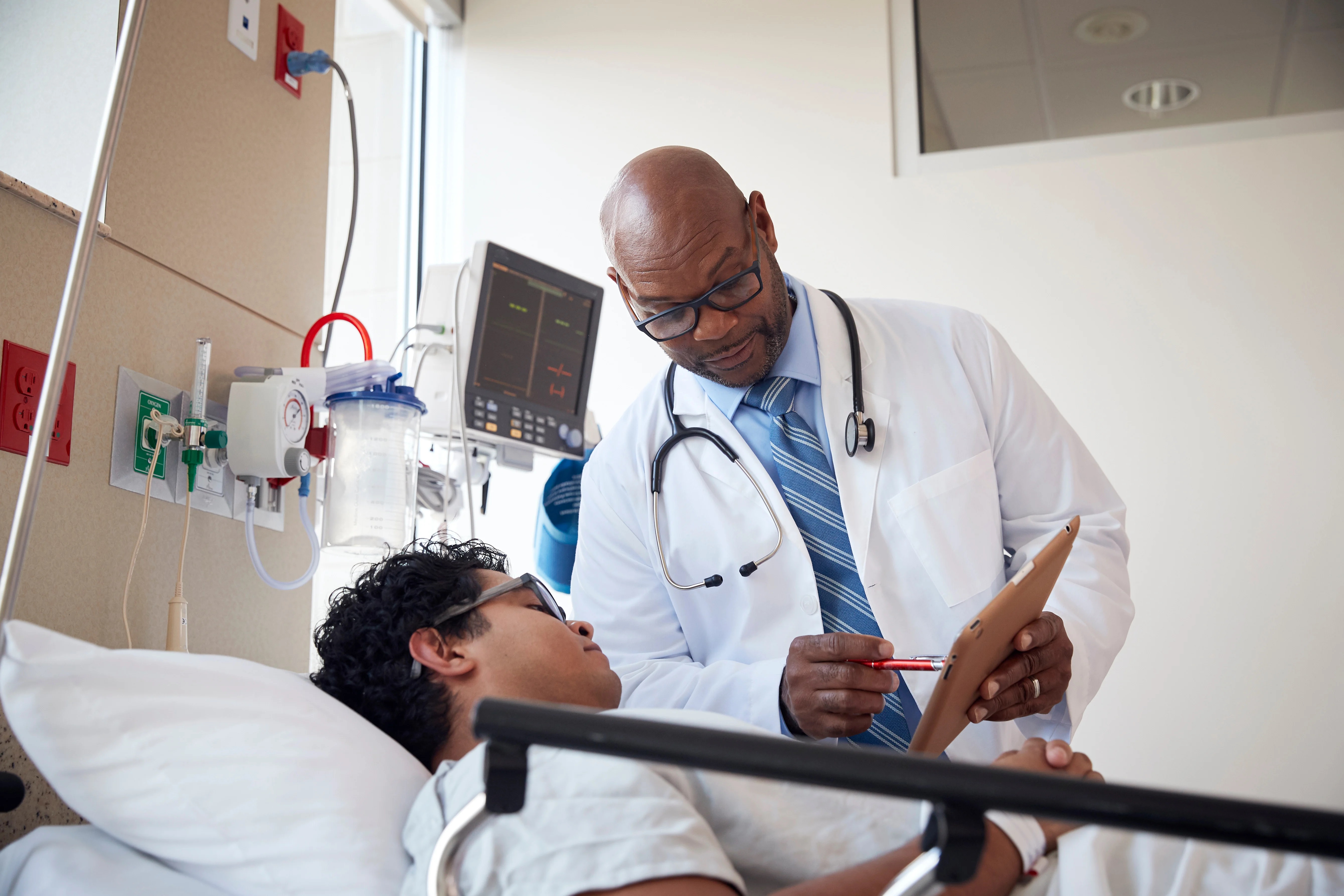 Image of doctor showing a chart to a patient