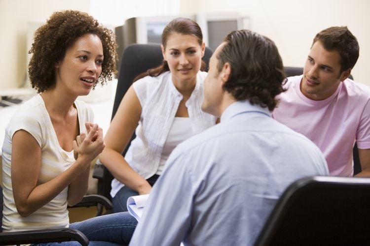 patients in a group speaking together