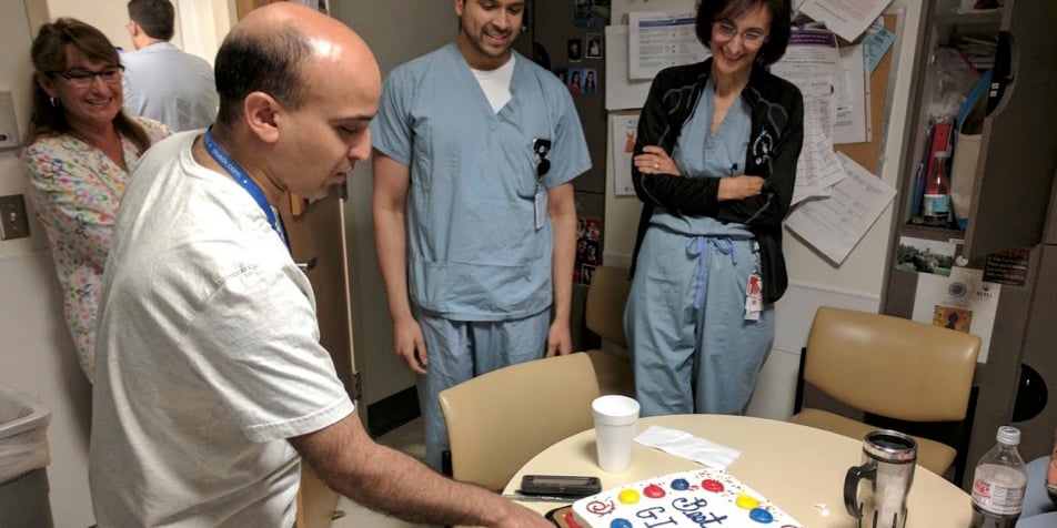 GI physicians celebrating with cake