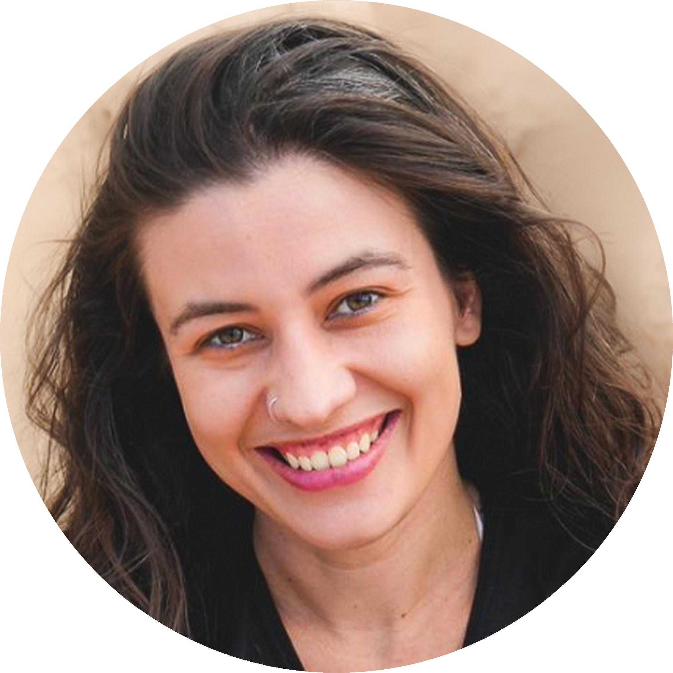 A headshot of Galvan Pena Silvia with a broad and warm smile. She has a long wavy dark hair and wears a small nose ring. 