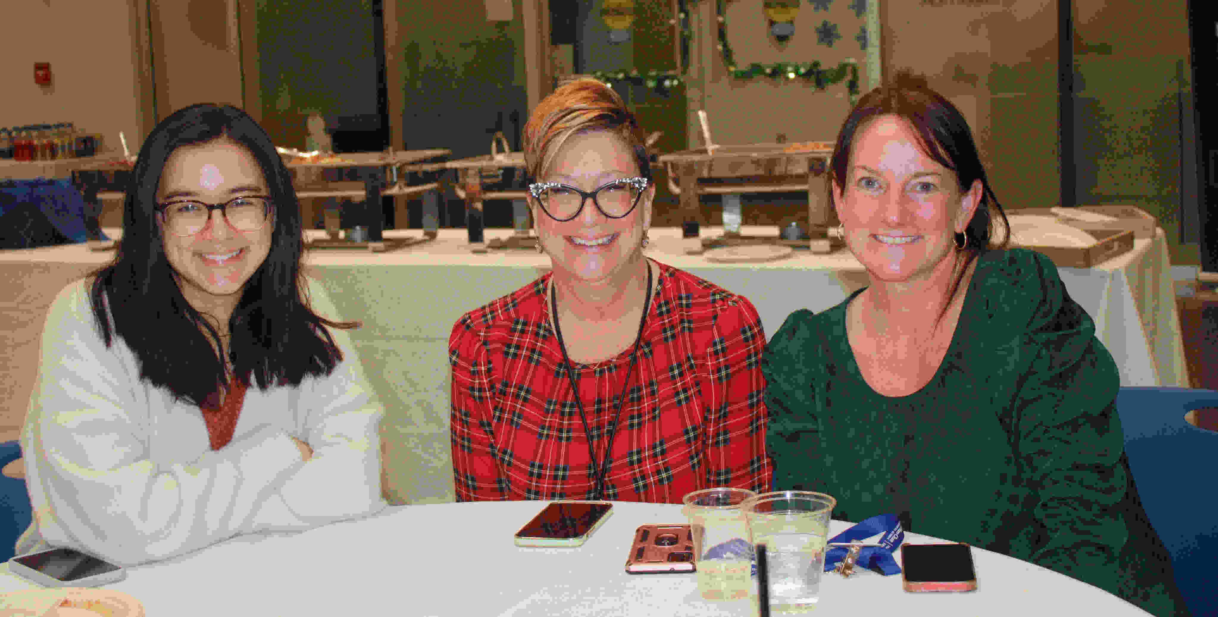 various team members from different neurology groups sitting at a table