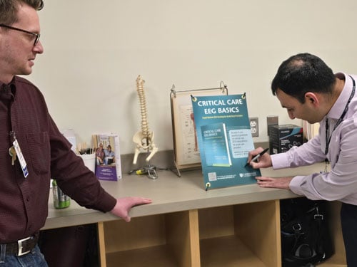 Neville Jadeja, MD, signing his book release poster