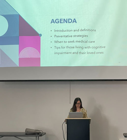 Kara Smith, MD, standing at a podium