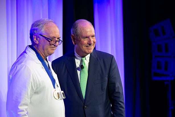 Theo Meyer, MD, PhD, accepts the Chancellor’s Medal for Distinguished Clinical Excellence.