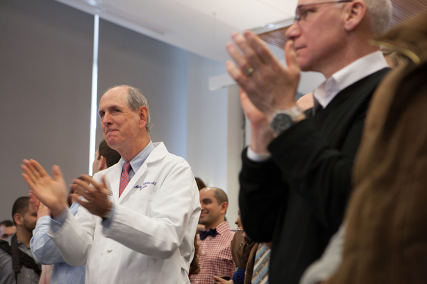 Chancellor Collins applauds the soon-to-be new doctors.