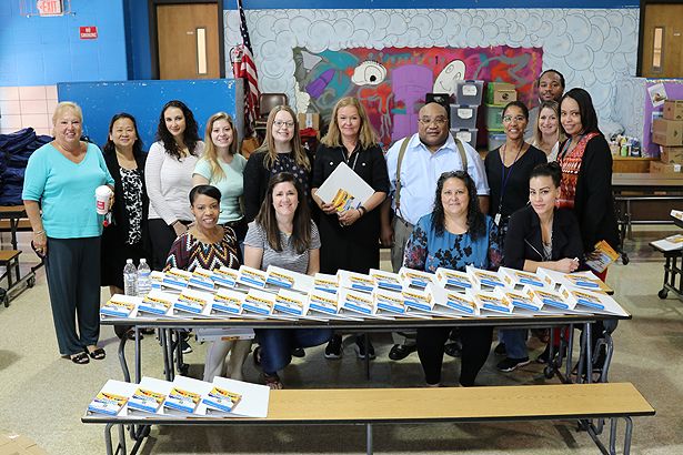 Members of the UMass Chan Medical School community prepare to distribute backpacks to students at Union Hill Elementary School.