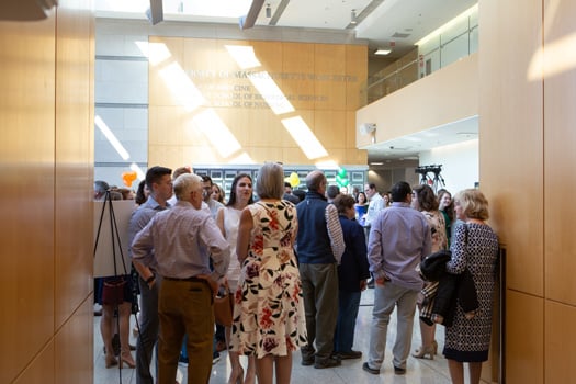 Family, friends and well-wishers await the noon announcement of where the 162 members of the Class of ’22 will do their residency training.