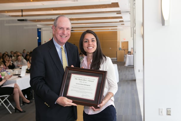 Chancellor Michael F. Collins presents the Chancellor’s Award to Geneva DeGregorio.