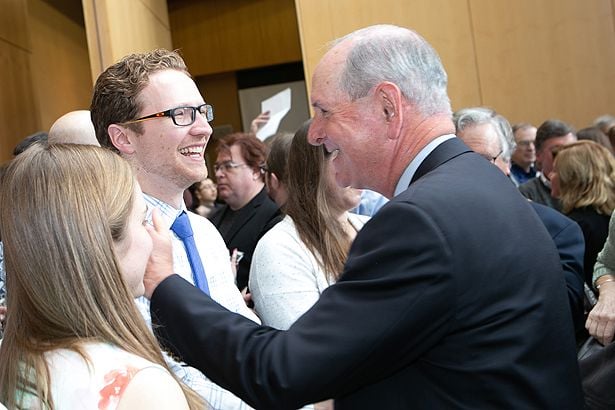 Chancellor Michael Collins congratulates John Sullivan on his residency.