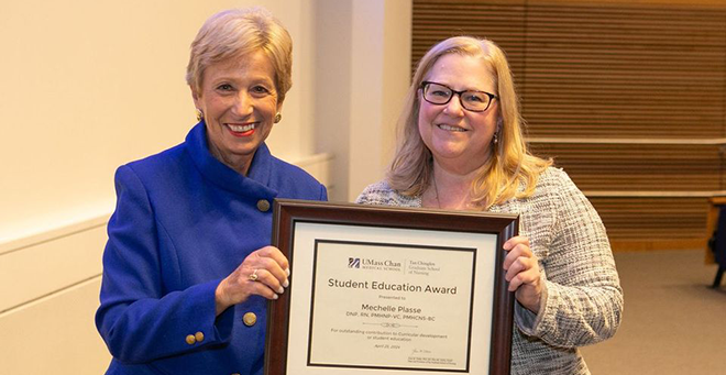 Joan Vitello-Cicciu, PhD, presents the Student Education Award to Mechelle Plasse, PhD, APRN.  