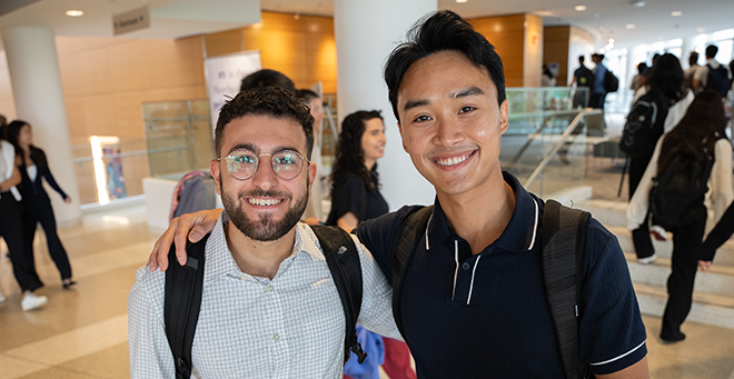 Jonathan Assaad and Hieu Tran standing together