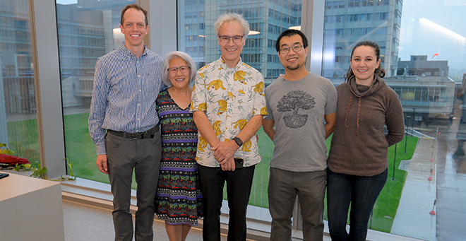 Members of the Ambros lab celebrate: From left, Charles Nelson, PhD; Rosalind “Candy” Lee; Victor Ambros, PhD; Ye “Oscar” Duan, PhD’23; and Reyyan Bulut.