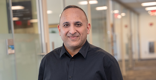 Sandeep Jubbal wearing a black button down shirt