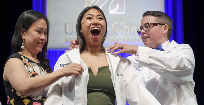 Kathy Nguyen exudes joy after getting her white coat